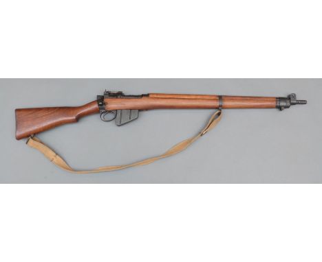 Deactivated Canadian Lee Enfield No4 Mk1 Long Branch .303 bolt action rifle with canvas sling, rear ladder sight, N49 and min