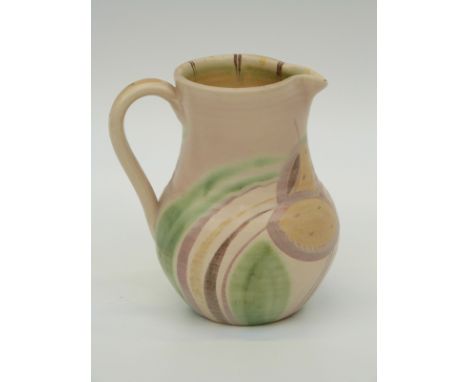 A studio pottery jug signed Susie Cooper to base, 15cm tall