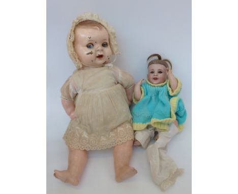 Societe de Fabrication des Bebes et Jouets (SFBJ) bisque headed doll with weighted deep blue eyes, open mouth, and jointed co