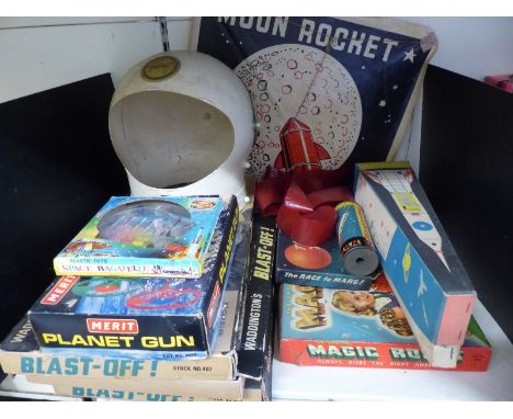 A collection of space related toys and games including NASA spacesuit helmet, Waddingtons Blast-Off, Merit Planet Gun etc