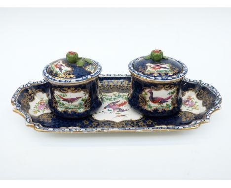 A 19thC porcelain double inkwell/ standish, the wells with leaf finials, probably Samson