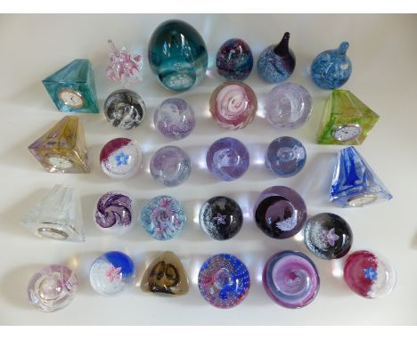 Twenty nine Caithness glass paperweights and paperweight clocks including Collectors' Society, Moondance 2002, boxed with cer