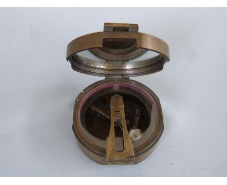 A brass military compass marked Brinton Compass, Thos Evans and Son London  