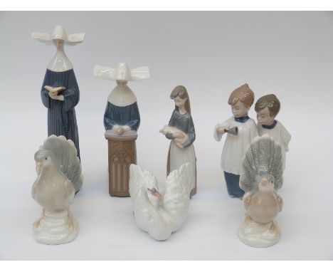 A quantity of Lladro, Nao and other ceramic figures including nuns