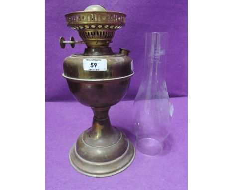 A brass bodied oil burning lamp