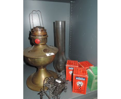 A brass bodies oil lamp by Famos 