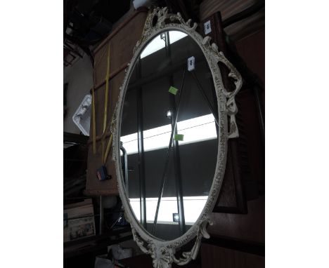 A vintage white painted mirror