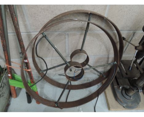A pair of cast wheel light fittings