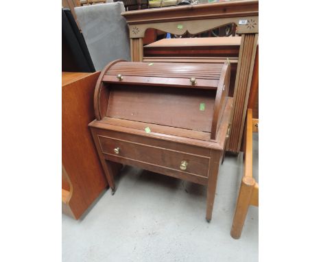 A vintage tambour top cabinet on casters