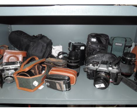 A selection of cameras and photographic equipment including Minolta xg-m etc