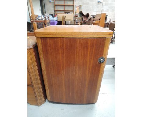 A vintage golden oak sewing machine cabinet and contents including cotton, reels etc