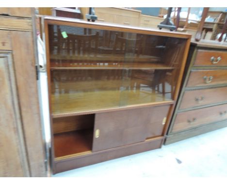 A vintage bookcase with cupboard under 