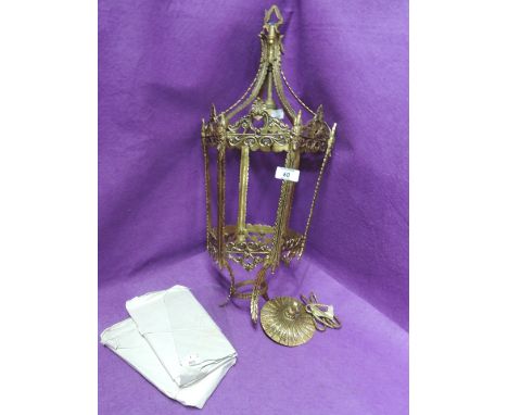 An ornate brass cast lantern style ceiling light 