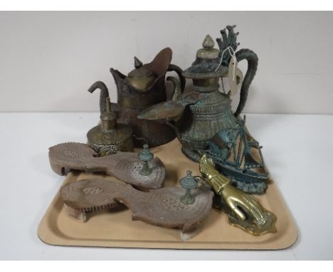 A tray containing Eastern metal tea pots, a brass oil can, a bronze figure of a Viking long ship, etc 