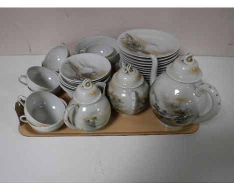 A tray containing a Japanese egg shell tea service 