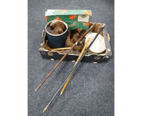 A box containing furs, vintage leather ladies handbag, two walking canes, one with silver mount, together with a walking stic