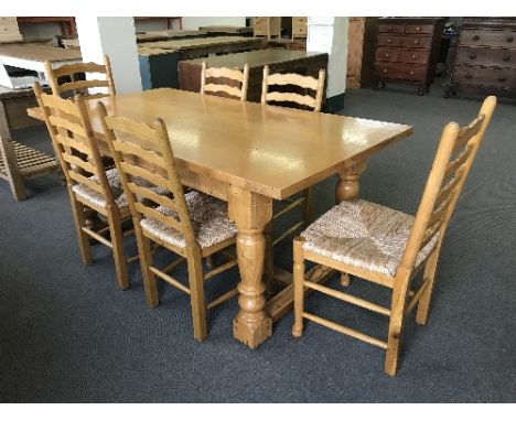 A good quality light oak farmhouse style refectory dining table, length 180 cm