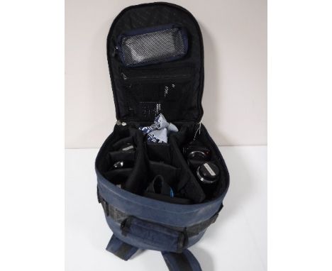 A Samsonite backpack, containing a Practika BX20 camera with lenses and accessories