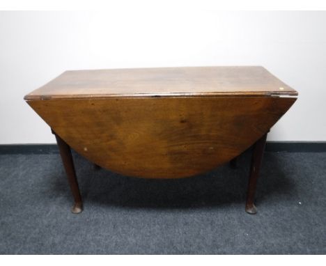 An antique mahogany gate leg table 