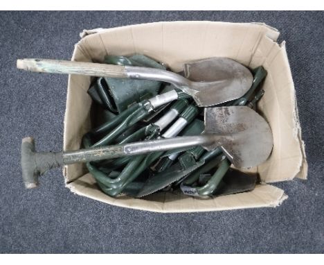 A box containing army shovels