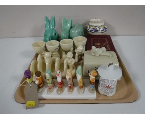 A tray of clover Walt Disney Snow White & Seven Dwarves toast rack, Lurpack toast rack egg cup holders and butter dish, Sylva