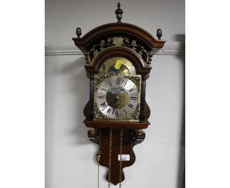 A brass faced mahogany wall clock, with moon phase dial 