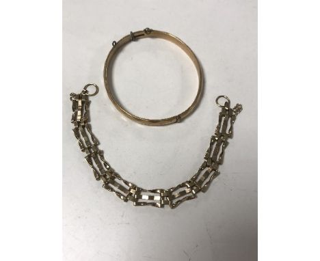A 9ct gold bangle and a 9ct gold gate bracelet 