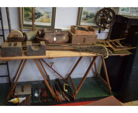 Tools - a hand-crank pillar drill; an early 20th century Gladstone type bag; saws; sledgehammer; footpump; hand drill; chisel