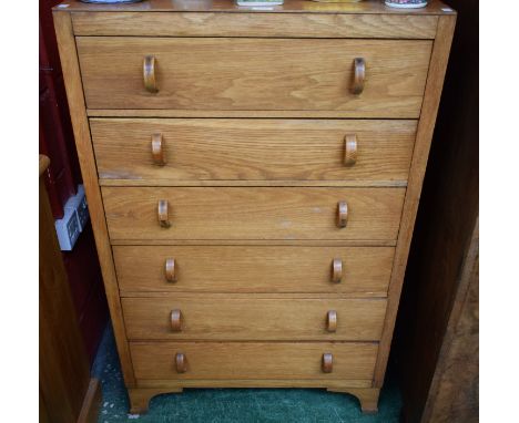 A mid-20th century Herbert &amp; Gibbs oak chest of six long drawers, bracket feet, 119cm high