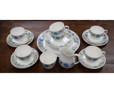 A Wedgwood Clementine pattern part tea service, for six, comprising cups, saucers, side plates, cake plate, milk jug and suga