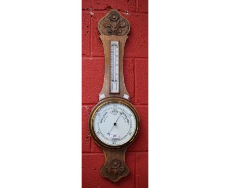 A 20th century carved oak barometer thermometer, 83cm high