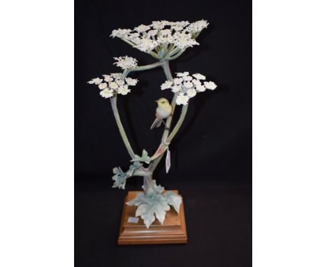 A Royal Worcester model Chiff Chaff Phylloscopus Rufus and Hogweed, 45cm, wooden stand 