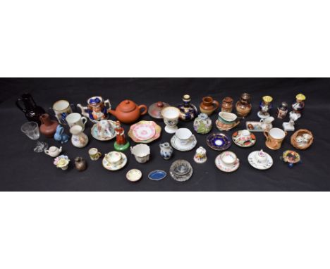 Ceramics - a miniature Meissen teacup and saucers, miniature Toby jugs, vases, 19th century and later; etc