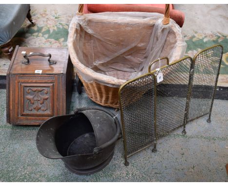 An oak purdonium; a wicker log basket; a brass firescreen; a brass coal bucket (4)