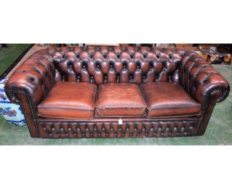 A 20th century leather scroll arm Chesterfield sofa, 190cm wide