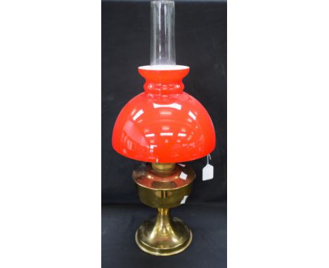 An Aladdin paraffin lamp, vibrant red shade 