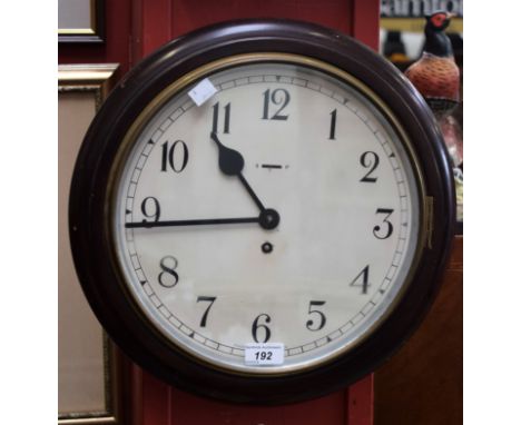 A mid 20th century mahogany framed station type clock, 30cm dial with bold Arabic numerals, minute track, marked Made In Grea