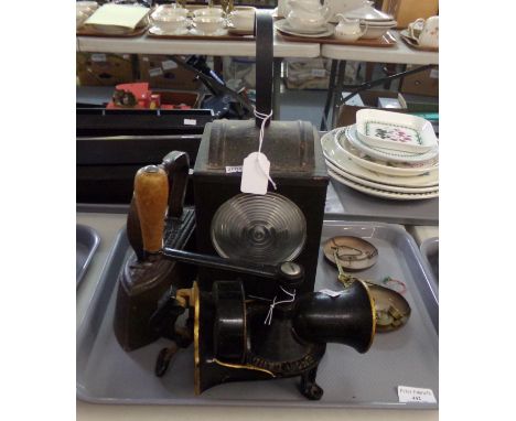 Tray of assorted items: vintage meat mincer, vintage flat iron, signal man's railway lantern and small copper balance scales 