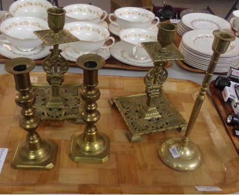 Five brass candlesticks: one pair of small candlesticks with pushers, probably late 19th/early 20th  century, one pair of ret