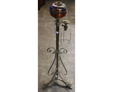 Arts and Crafts design brass and copper standard lamp oil burner, now converted to electricity on a wrought iron scroll decor