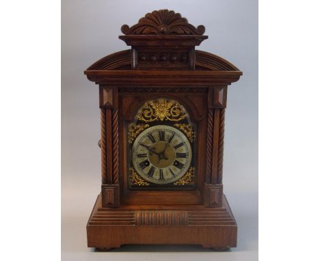 Early 20th century walnut two train architectural design mantle clock. (B.P. 21% + VAT)