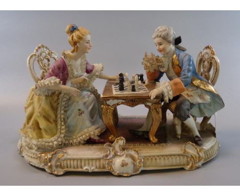 Capodimonte porcelain figural group of a couple at a table playing chess.  (B.P. 21% + VAT) 