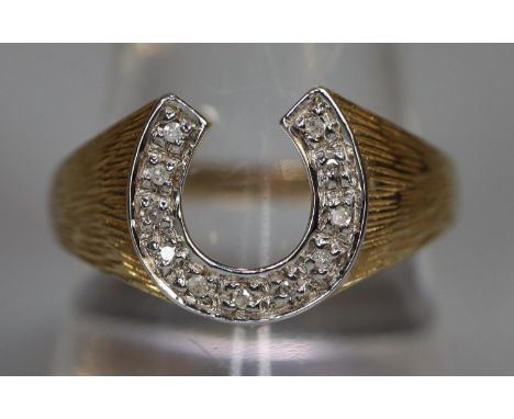 9ct gold diamond set horseshoe design dress ring.  3.2g approx.  Ring size R.  (B.P. 21% + VAT) 