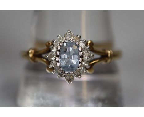 9ct gold aquamarine and diamond split shank dress ring.  2.6g approx.  Ring size T.  (B.P. 21% + VAT) 