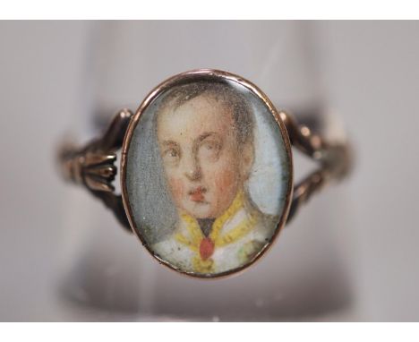 19th century Georgian style gold signet ring set with miniature portrait panel of a young gentleman.  1.3g approx.  Ring size