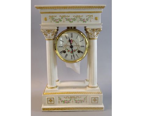 Modern ceramic architectural design pillared two train mantle clock with raised floral and foliate decoration.  (B.P. 21% + V