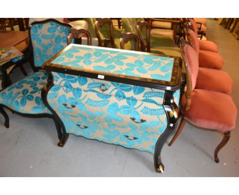 Modern reproduction black and gilt lacquer bombe shaped three drawer commode chest, the top and drawer fronts covered in a mo