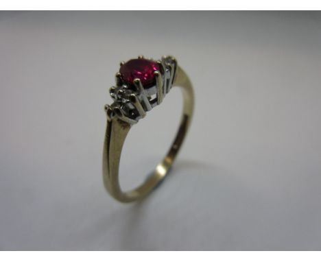 9ct Gold ruby and diamond dress ring, together with a metal mounted crystal pendant