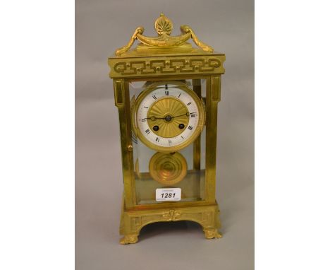 19th Century French gilt brass four glass two train mantel clock striking on a gong, the white chapter ring enclosing an engi