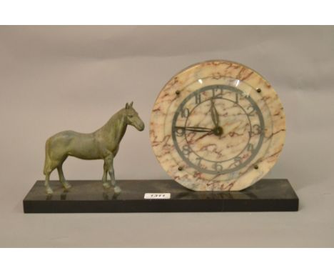 Art Deco marble black slate and patinated metal mantel clock in the form of a horse standing beside the circular dial